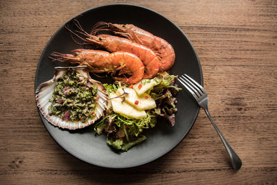 High angle view of vegetables in plate on table