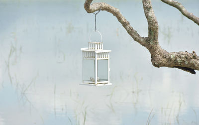 Close-up of metal hanging over lake