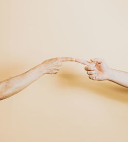 Close-up of hand against white background