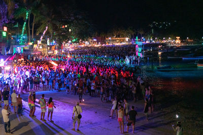 High angle view of people on street at night