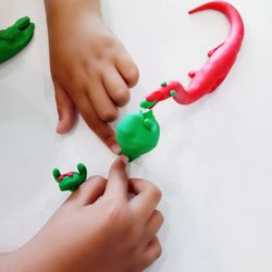 Midsection of woman holding toy