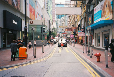 People walking on street in city