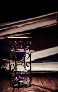 Close-up of illuminated electric lamp on table