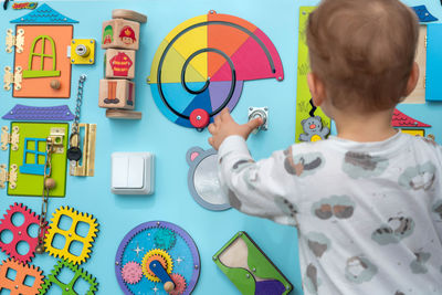 Portrait of boy playing with toy blocks