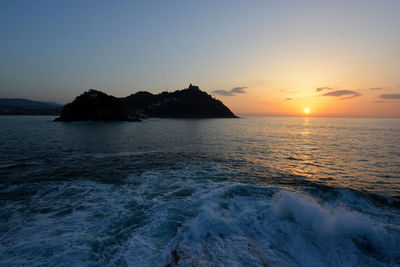 Scenic view of sea against sky during sunset