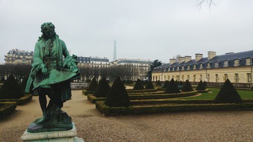 Statue in ornamental garden