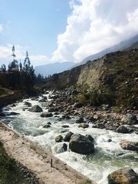 Scenic view of stream against sky