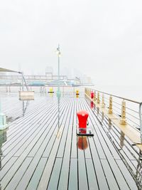 Pier on sea against clear sky