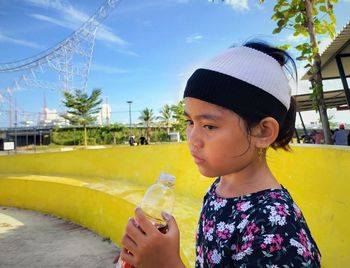 Portrait of a girl drinking water