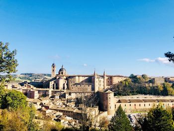 View of townscape against blue sky