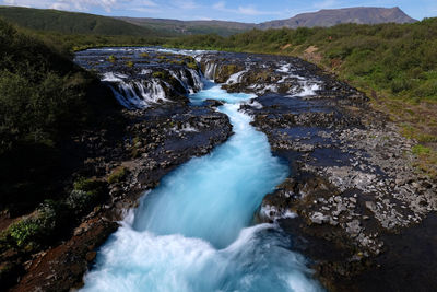 High angle view of waterfall in forest