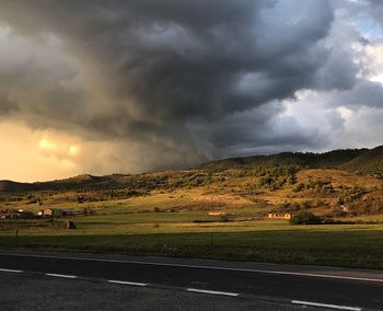 Scenic view of landscape against cloudy sky