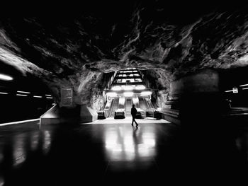 People walking in illuminated building