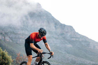 Man riding bicycle on mountain