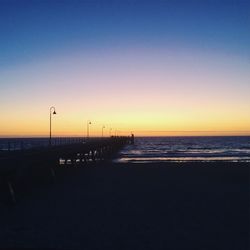 Scenic view of sea against clear sky during sunset