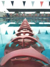 Close-up of shoes on swimming pool in city