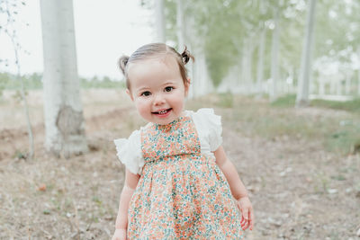 Portrait of cute girl standing outdoors