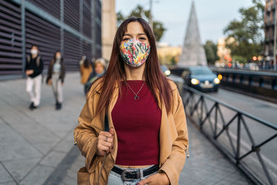 Portrait of a young woman standing outdoors