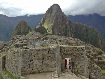 View of old ruins against cloudy sky