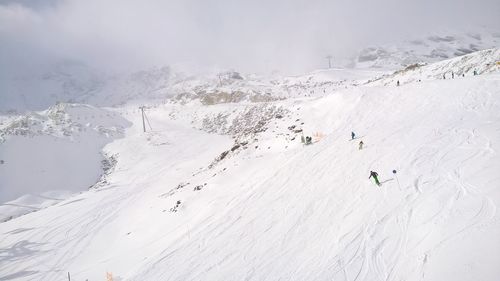 Scenic view of snowcapped mountains during winter