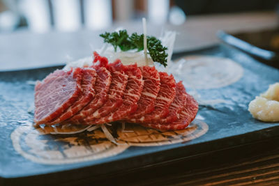 Close-up of meat in plate on table