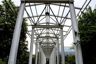 Low angle view of metal structure against sky