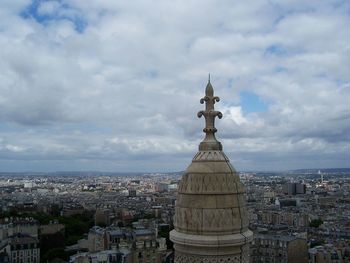 High angle view of cityscape against cloudy sky