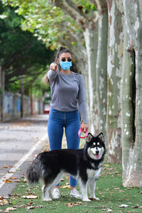 Full length of woman with dog