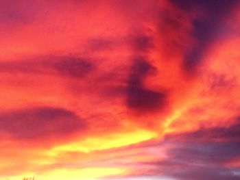 Low angle view of cloudy sky at sunset