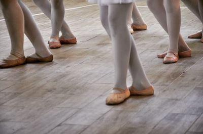 Low section of woman standing on floor