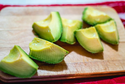 High angle view of chopped avocado on cutting board