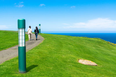 Scenic view of sea against blue sky