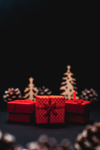 Close-up of christmas decoration on table against black background