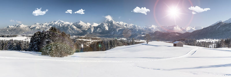 Scenic view of snowcapped mountains against sky