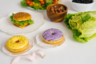 Healthy or unhealthy food. conceptual photo of healthy and unhealthy food with measuring 