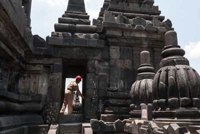 Workers spread the anti bacterial at prambanan temple to blick covid-19 