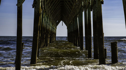 Pier over sea against sky