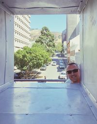 Portrait of man by swimming pool