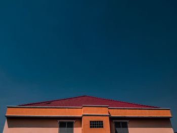 Low angle view of building against blue sky