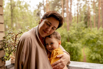 Happy grandmother and grandson enjoy time together. positive middle age woman