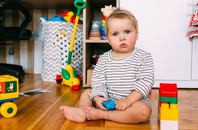 Cute little child is playing at home