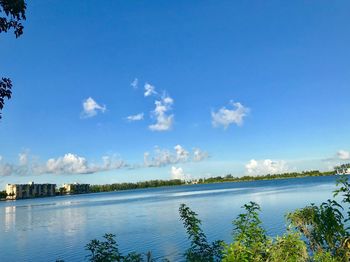 Scenic view of lake against blue sky