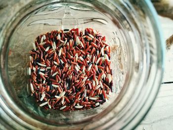 High angle view of rice in jar on table