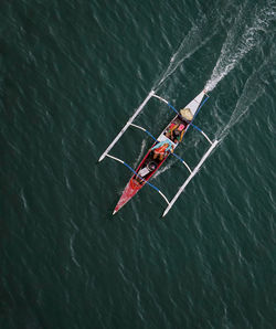 High angle view of people on boat in sea