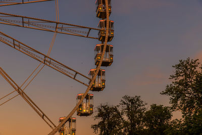 Part of a ferris wheel in sunset