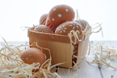 High angle view of easter eggs in basket on table