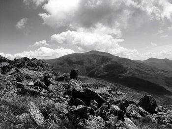 Scenic view of mountains against cloudy sky