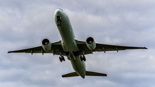 Low angle view of airplane against sky