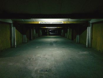 Empty road with lights in background