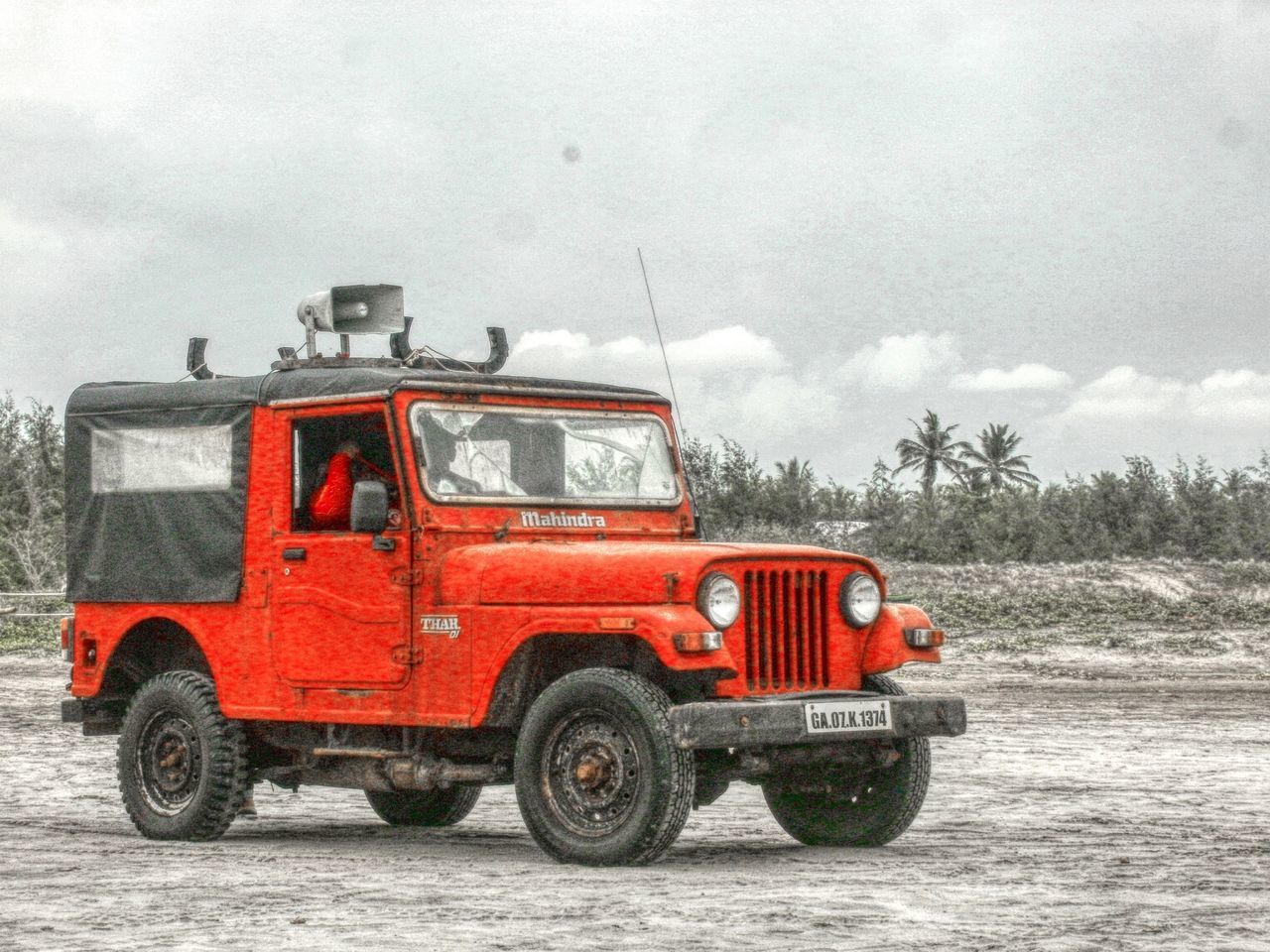 land vehicle, transportation, mode of transport, car, red, stationary, parked, sky, field, parking, travel, tractor, weather, rural scene, street, day, cloud - sky, outdoors, road, no people